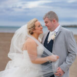 Bride and Groom embraced on Enniscrone beach during their wedding at the Diamond Coast Hotel enniscrone co.sligo