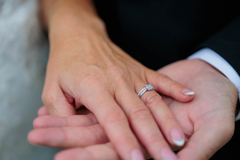 Bride holding grooms hand at the Radisson Blu Hotel Sligo wedding of Kelly and Luke